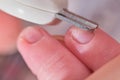 Cutting nails with special scissors on the fingers of a newborn baby, children manicure and cutting burrs Royalty Free Stock Photo