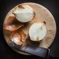 Cutting Onions on Round Board Top View on Slate Royalty Free Stock Photo