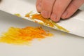 Cutting orange and citron zests Royalty Free Stock Photo