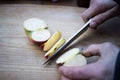 Cutting organic apple in boats