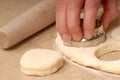 Cutting out buttermilk biscuit dough Royalty Free Stock Photo