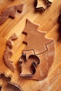 Cutting out pastry shapes for gingerbread Christmas cookies - traditional holiday dessert Royalty Free Stock Photo