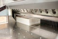 Cutting paper with professional press machine Royalty Free Stock Photo