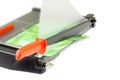 Cutting paper with trimmer on white Royalty Free Stock Photo