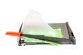 Cutting paper with trimmer on white Royalty Free Stock Photo
