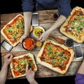 Cutting pizza. Domestic food and homemade pizza. Royalty Free Stock Photo