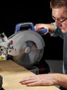 Cutting plank with mitre saw Royalty Free Stock Photo