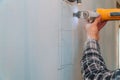 Cutting plasterboard plaster hand with electro saw