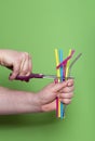 Cutting plastic straws. Metal drinking straw. Reduce plastic waste Royalty Free Stock Photo