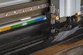 Cutting plotter close-up. The process of cutting a vinyl film