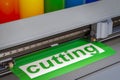 Cutting plotter close-up. The process of cutting a vinyl film