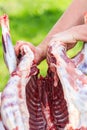 Cutting process of young lamb carcass Royalty Free Stock Photo