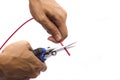 Cutting red cable with nippers Royalty Free Stock Photo