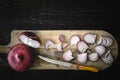 Cutting red onion on the wooden board top view Royalty Free Stock Photo