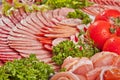 Cutting sausage and cured meat with a parsley Royalty Free Stock Photo