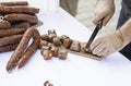 Cutting sausage with a knife Royalty Free Stock Photo