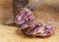 Cutting spanish salami slices