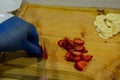 Cutting strawberries and banana on wooden table Royalty Free Stock Photo