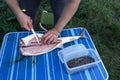 cutting sturgeon and get black caviar. Black caviar Royalty Free Stock Photo