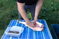 cutting sturgeon and get black caviar. Black caviar Royalty Free Stock Photo