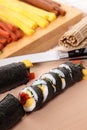 Cutting sushi with ingredients and knife background Royalty Free Stock Photo