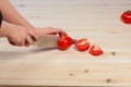 Cutting tomatoes for dishes on the table. Vegetables during the cooking process dishes. Vegetables for healthy eating