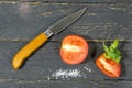 Cutting tomatoes with a sharp pocket knife. Royalty Free Stock Photo