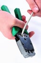 Cutting an utp cable with a network tool.Stages Of The Process Royalty Free Stock Photo