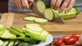 Cutting vegetables for a guacamole with vegies recipe