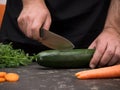 Cutting vegetables on a stone table for meal preparation Royalty Free Stock Photo