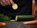 Cutting vegetables on a stone table for meal preparation Royalty Free Stock Photo