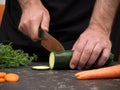 Cutting vegetables on a stone table for meal preparation Royalty Free Stock Photo