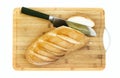 cutting white bread loaf on hardboard and knife Royalty Free Stock Photo