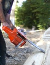Cutting wood with motor saw