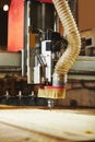 Cutting wood using a machine with numerical control. Cnc tool. Royalty Free Stock Photo