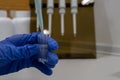 Cuvette tubes are a tool used in various laboratories. The researcher takes them to measure the absorbance, transmittance, Royalty Free Stock Photo
