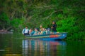 CUYABENO, ECUADOR - NOVEMBER 16, 2016: Unidentified people travelling by boat into the depth of Amazon Jungle in