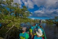 CUYABENO, ECUADOR - NOVEMBER 16, 2016: Unidentified people travelling by boat into the depth of Amazon Jungle in