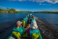 CUYABENO, ECUADOR - NOVEMBER 16, 2016: Unidentified people travelling by boat into the depth of Amazon Jungle in