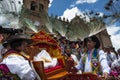 Group of people wearing traditional clothes and masks during the Huaylia on Christmas day in front of the Cuzco Cathedral