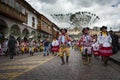 A group of people wearing traditional clothes and masks during the Huaylia on Christmas day