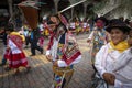 A group of people wearing traditional clothes and masks during the Huaylia on Christmas day at the Plaza de Armas square in the ci