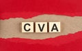 CVA word on wooden cubes on red torn paper , financial concept background