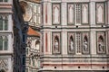 CView of detail carved in marble from the Santa Maria del Fiore Cathedral and Giotto`s Campanile in Florence.