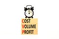 CVP cost volume profit symbol. Concept words CVP cost volume profit on wooden blocks on a beautiful white background. Black alarm