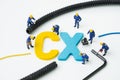 CX, Customer Experience concept, miniature figure worker building alphabet CX at the center, important of customer centric