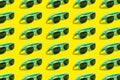 Cyan, aqua menthe sunglasses pattern isolated on background of yellow color.