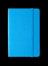 Cyan blue closed notebook isolated on black