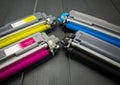 Cyan, magenta, amariyllo and black color toner rollers of a foreground color laser printer Royalty Free Stock Photo