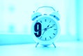 Cyan nine o'clock morning clock bokeh background Royalty Free Stock Photo